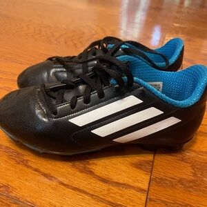 Black and Blue Soccer Cleats with White Stripes